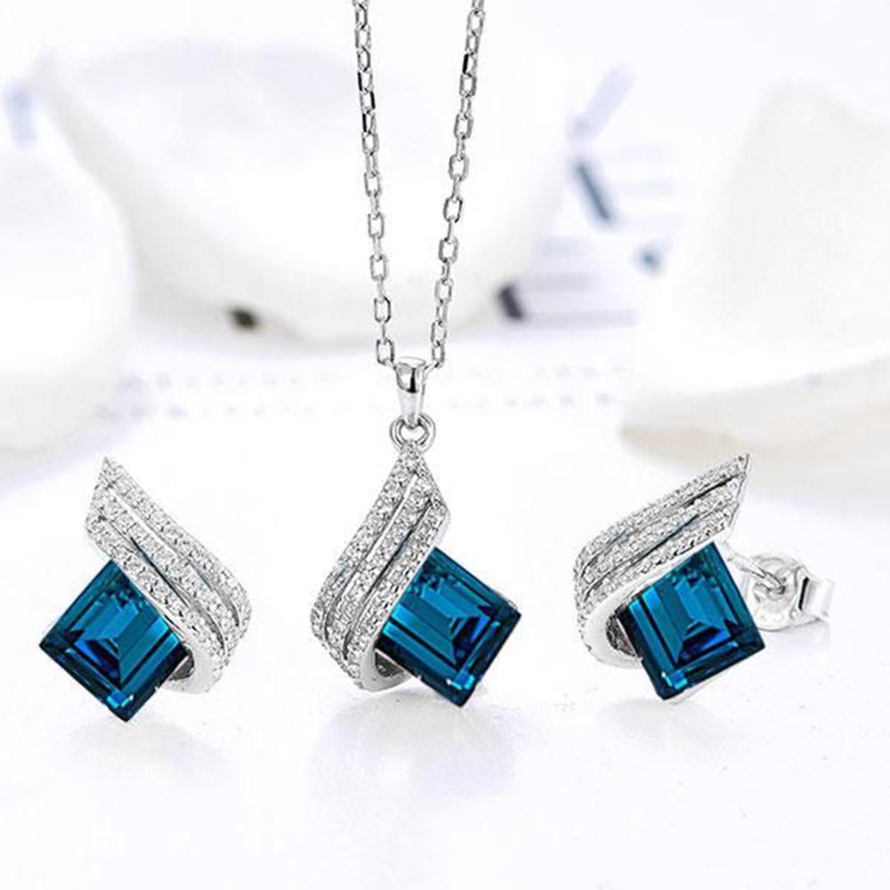 Mahi Shining Angel Wings Montana Blue and White Crystal Pendant Necklace Earrings Set